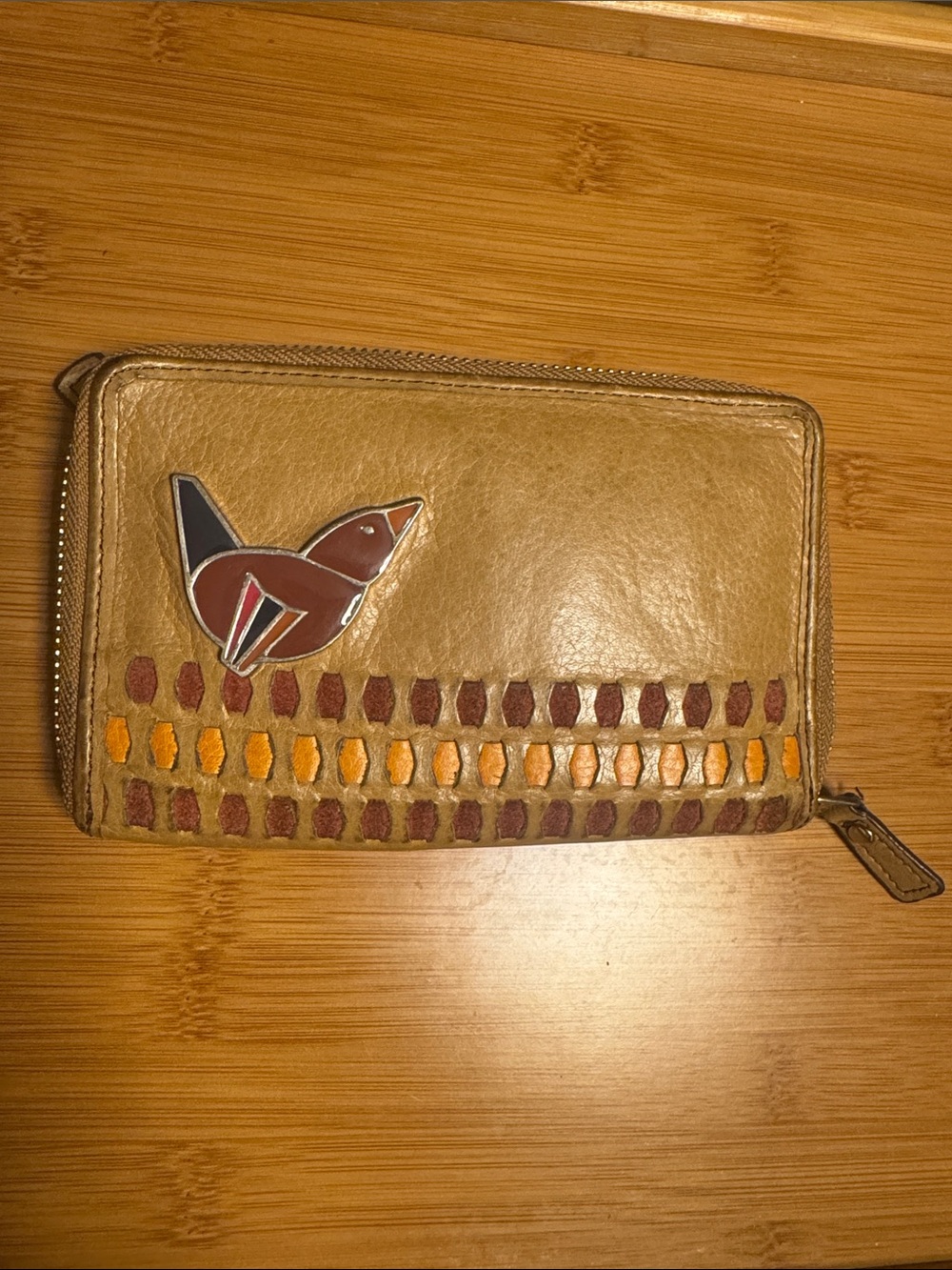 Fossil tan leather zip wallet with embossed logo